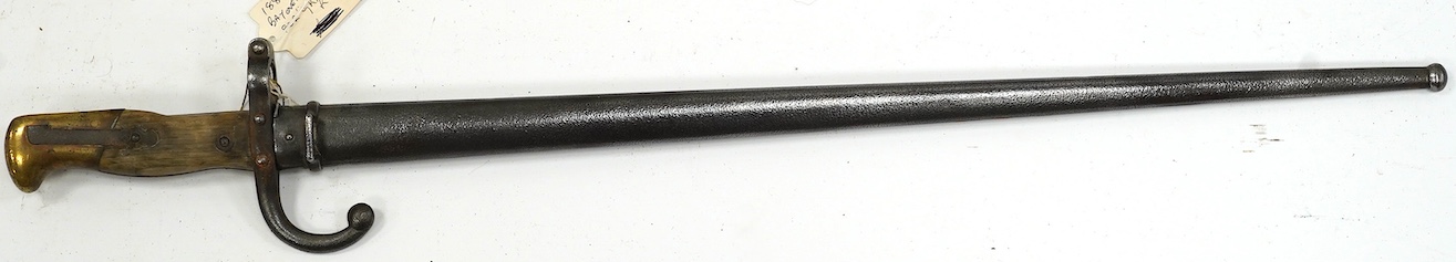 An 1880 French bayonet and scabbard for a Gras rifle. Condition - good, some pitting